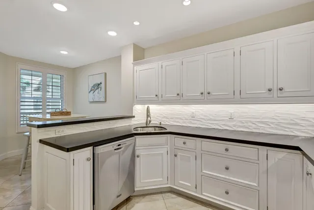 a bedroom with a bed and a table