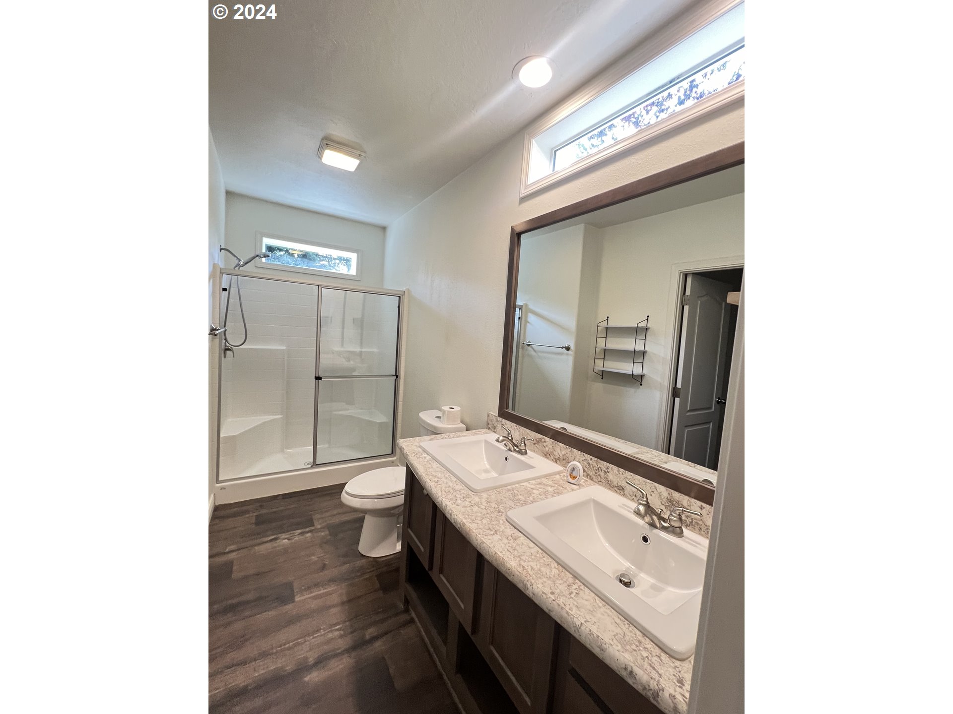 28312 Mateer Road Gold Beach, OR 97444 - Photo 15 of 25 a bathroom with a double vanity sink and mirror with toilet