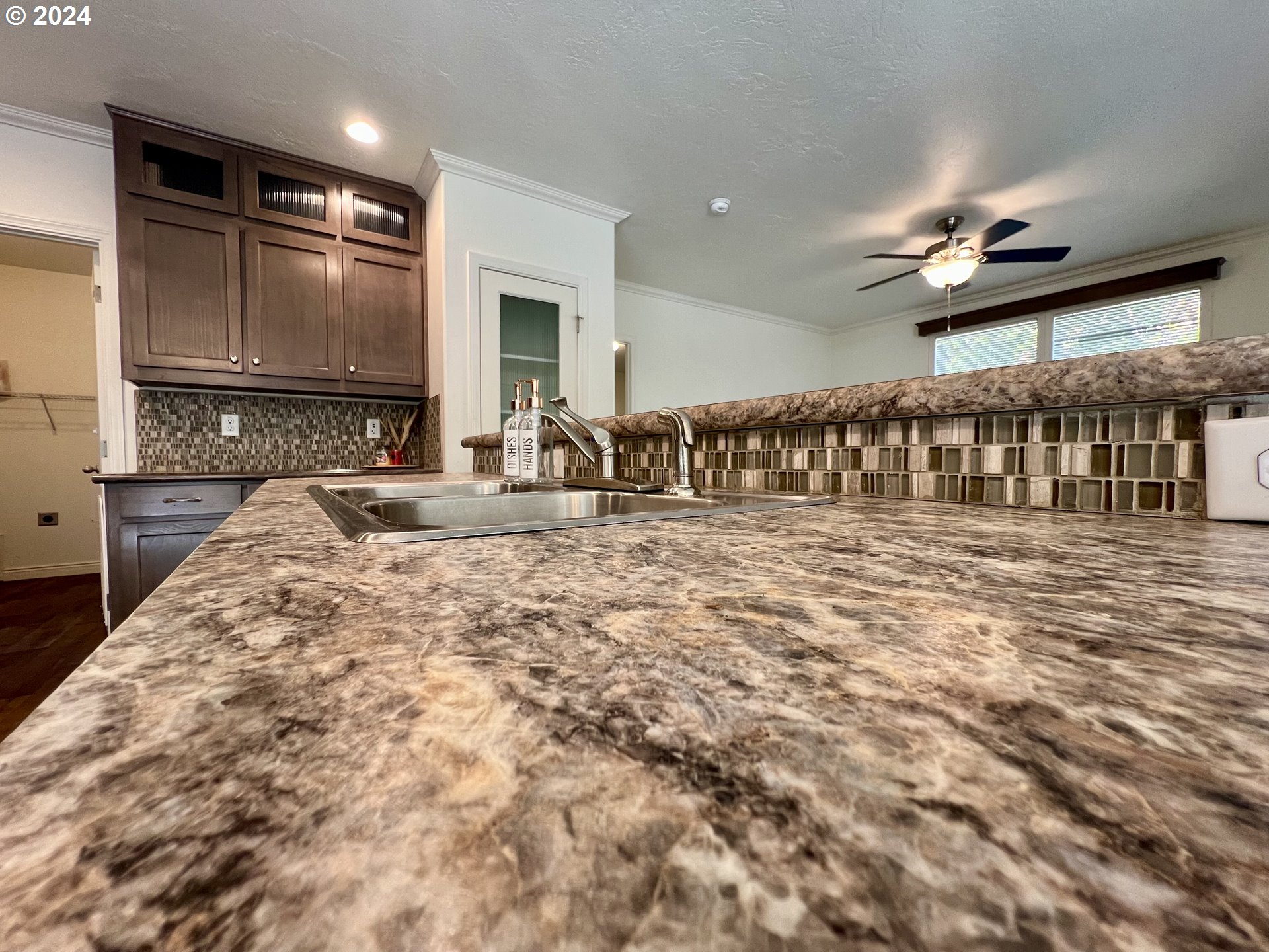 28312 Mateer Road Gold Beach, OR 97444 - Photo 8 of 25 a kitchen with counter top and ceiling fan