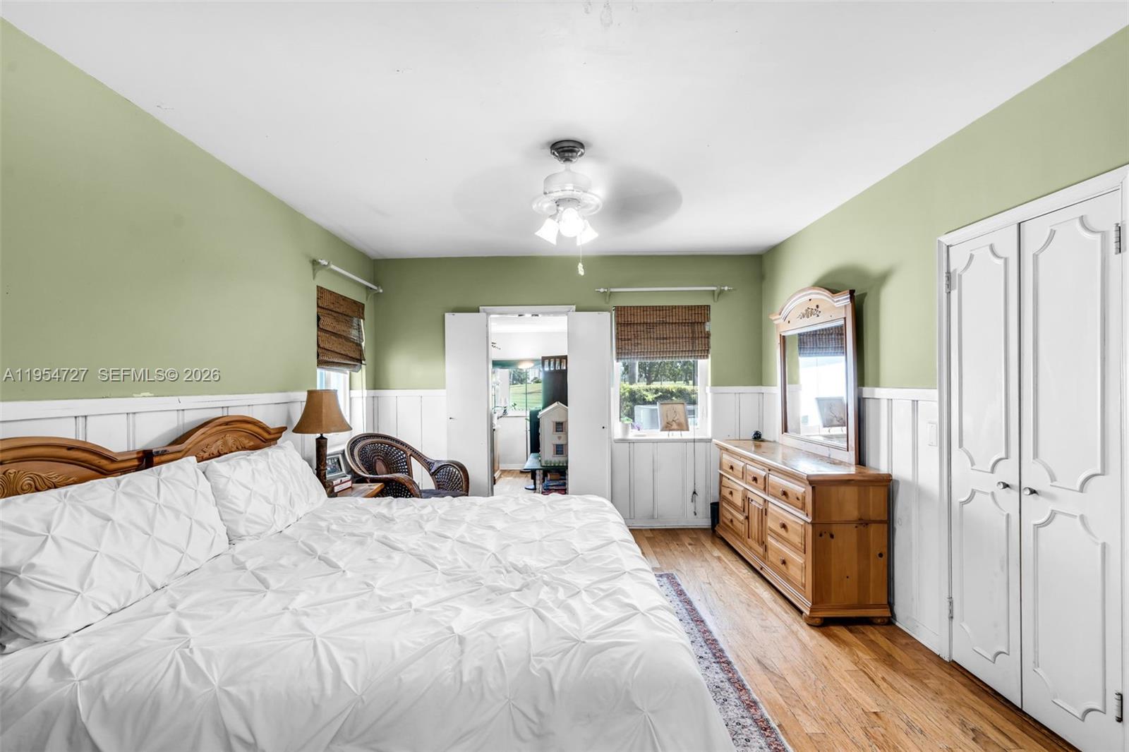 5965 Alton Road Miami Beach, FL 33140 - Photo 19 of 29 a large bedroom with a bed and large window