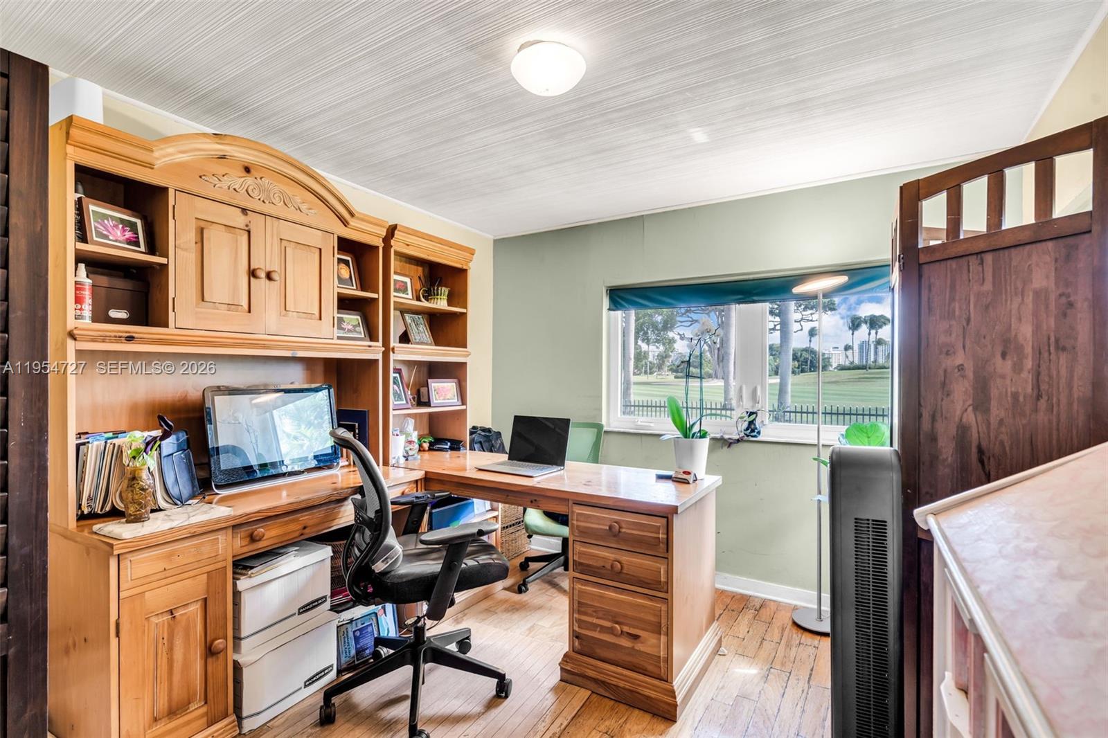 5965 Alton Road Miami Beach, FL 33140 - Photo 20 of 29 a view of a workspace with furniture and a window
