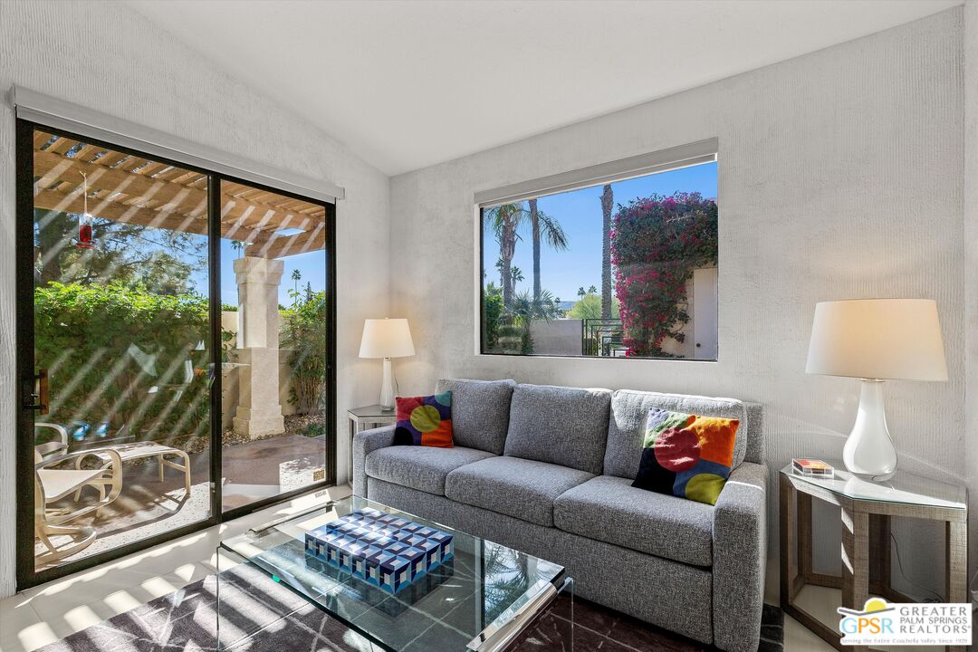 10201 Lakeview Drive Rancho Mirage, CA 92270 - Photo 17 of 28 a living room with a couch and a floor to ceiling window