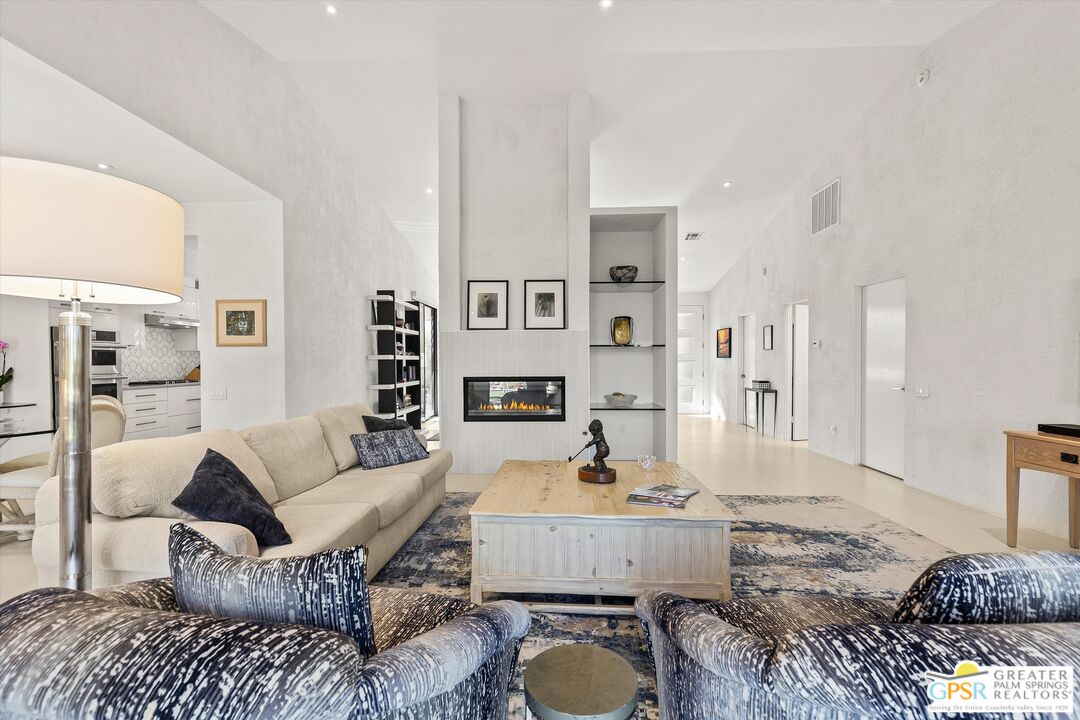 10201 Lakeview Drive Rancho Mirage, CA 92270 - Photo 20 of 28 a living room with furniture and a table