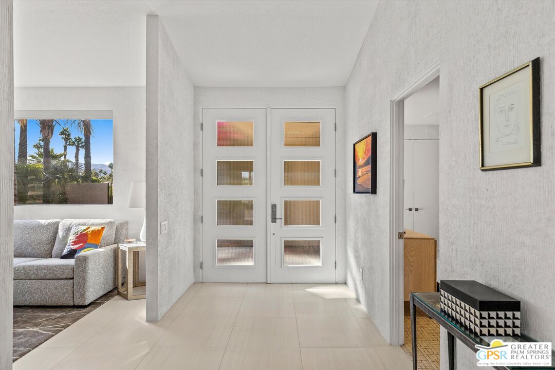 10201 Lakeview Drive Rancho Mirage, CA 92270 - Photo 2 of 28 a living room with furniture and a book shelf