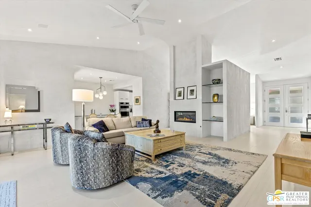 a living room with furniture and a rug