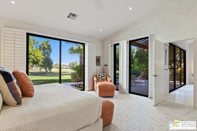 a bed room with a bed and a couch