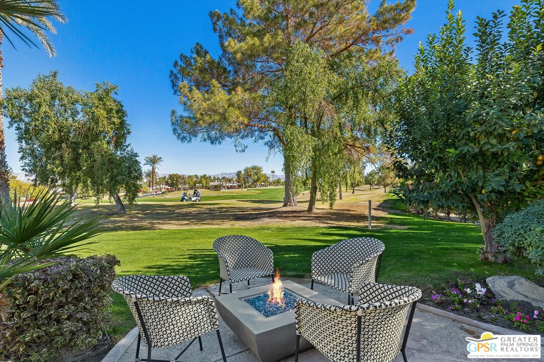 10201 Lakeview Drive Rancho Mirage, CA 92270 - Photo 10 of 28 a view of a table and chairs in the garden