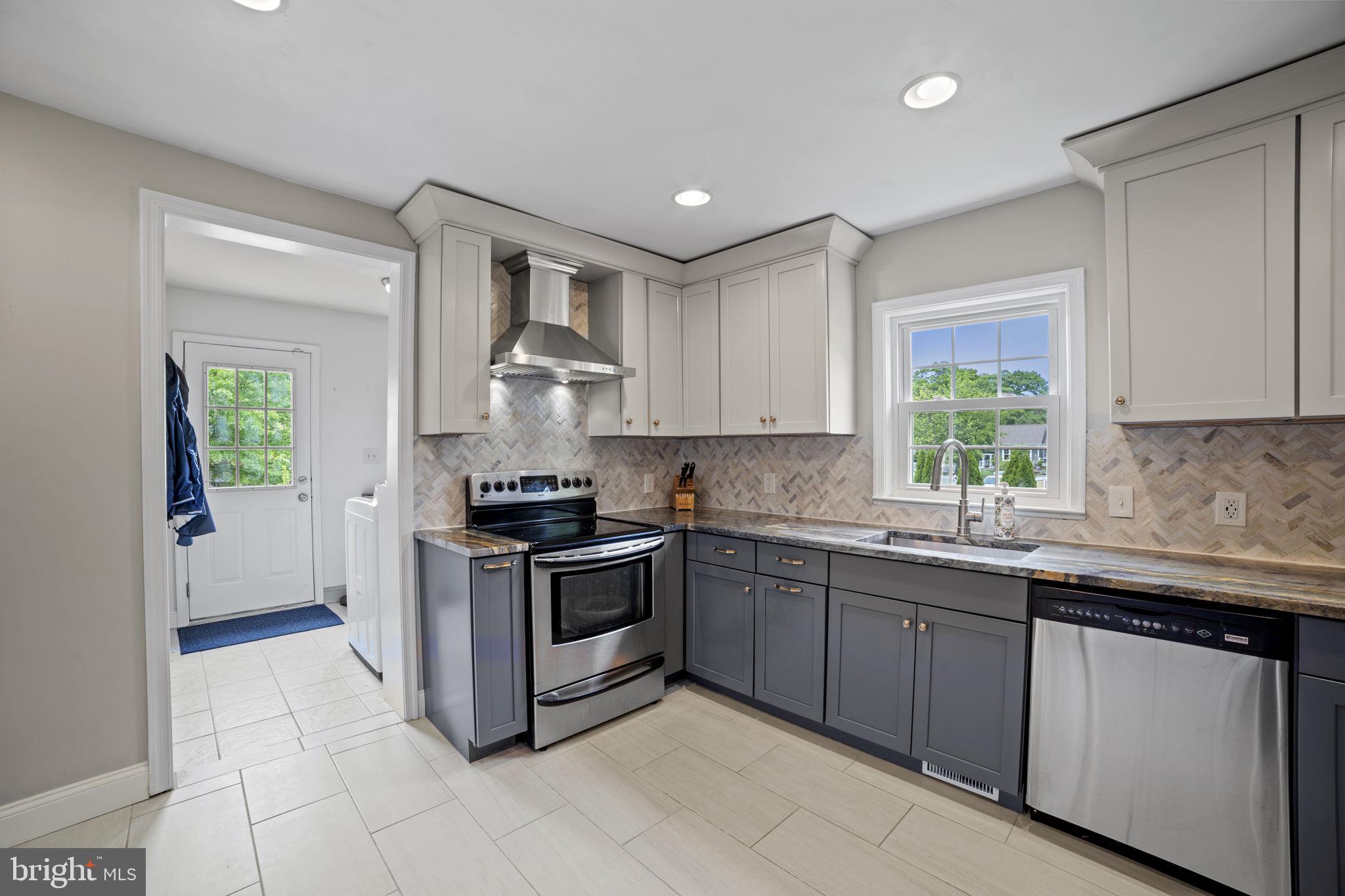 705 Dranesville Road Herndon, VA 20170 - Photo 11 of 22 Modern kitchen with sleek finishes.