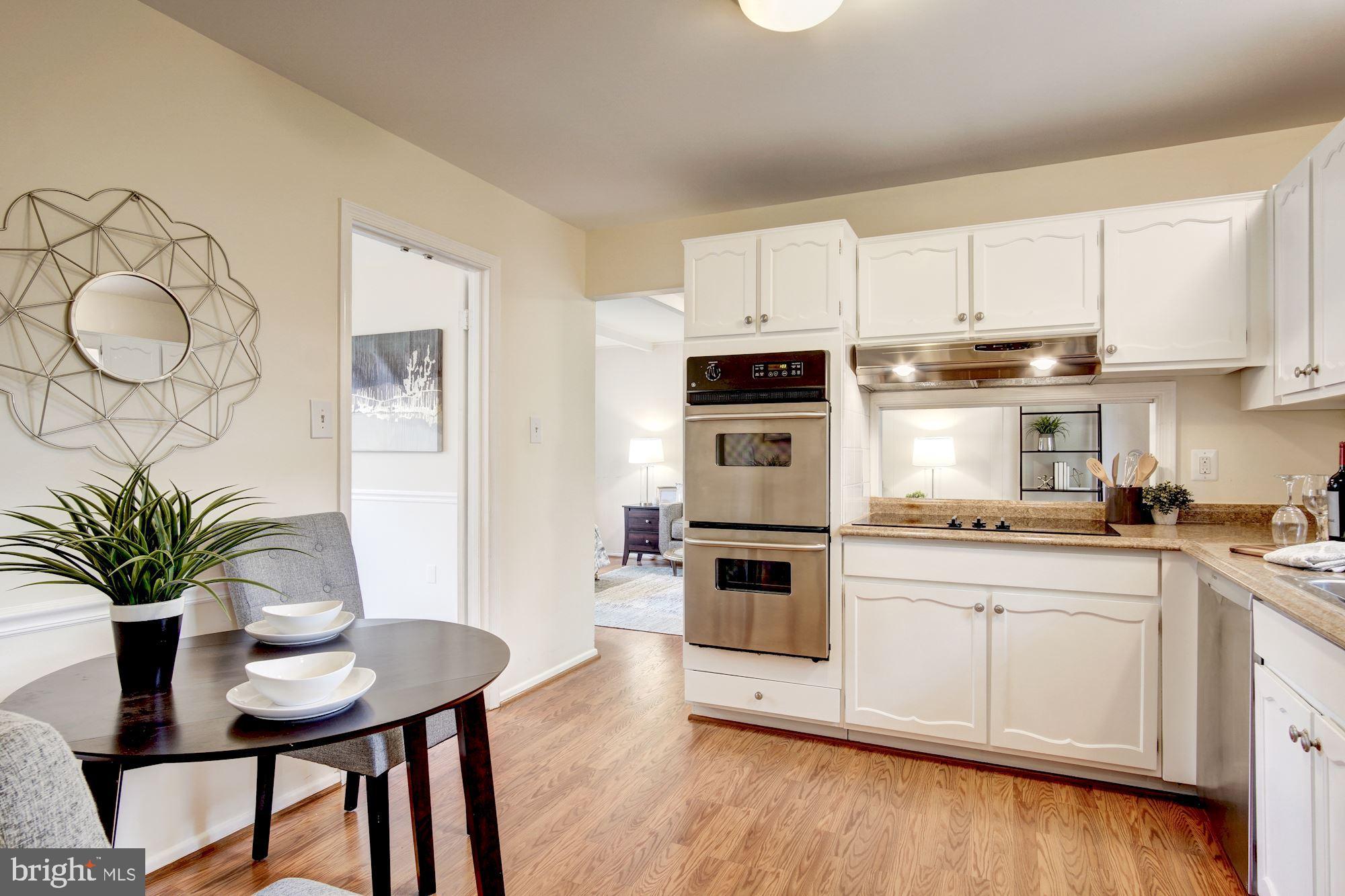 8208 Greeley Boulevard Springfield, VA 22152 - Photo 13 of 41 Eat-in kitchen with stainless steel appliances