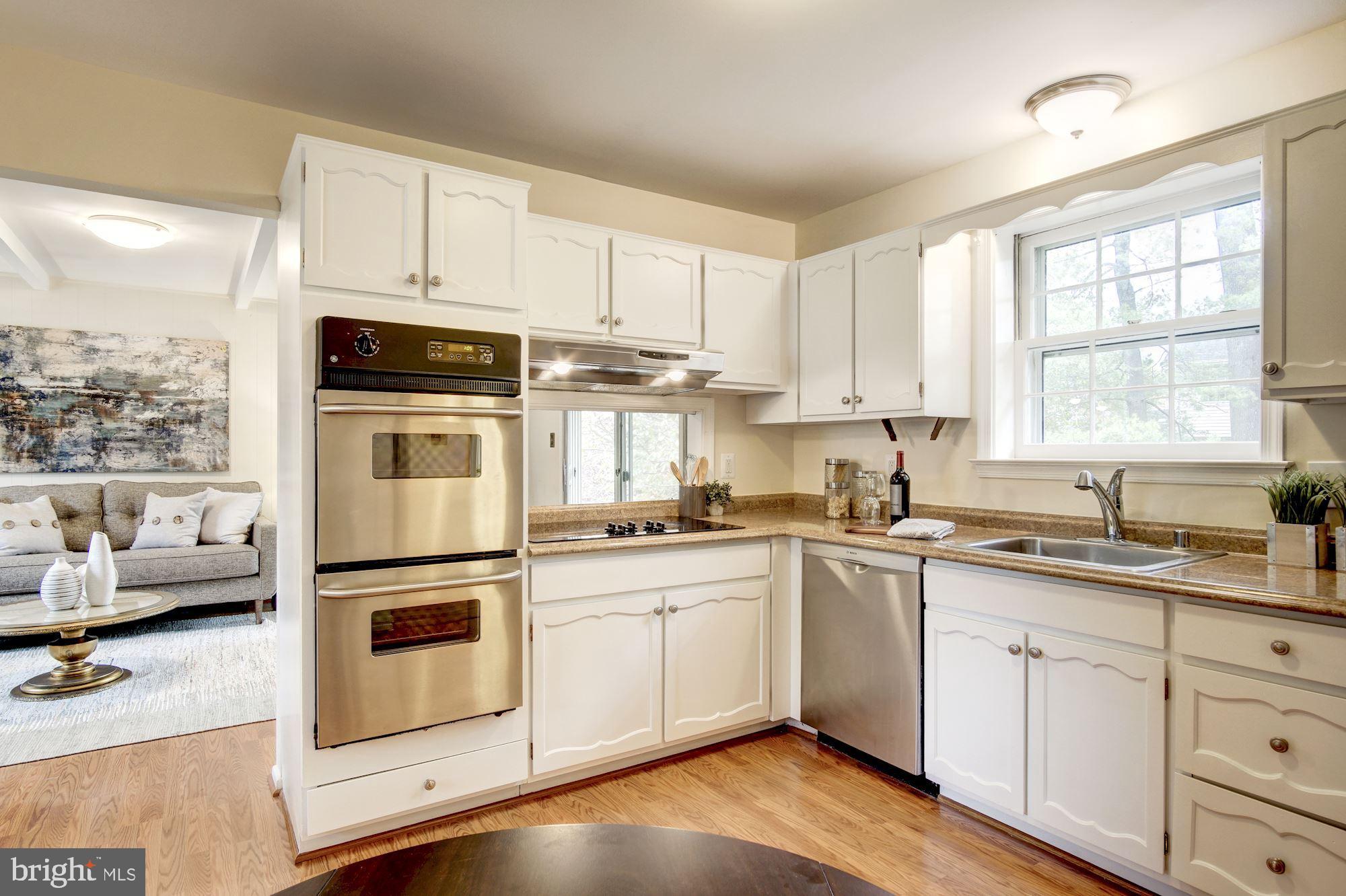 8208 Greeley Boulevard Springfield, VA 22152 - Photo 14 of 41 Eat-in kitchen with stainless steel appliances