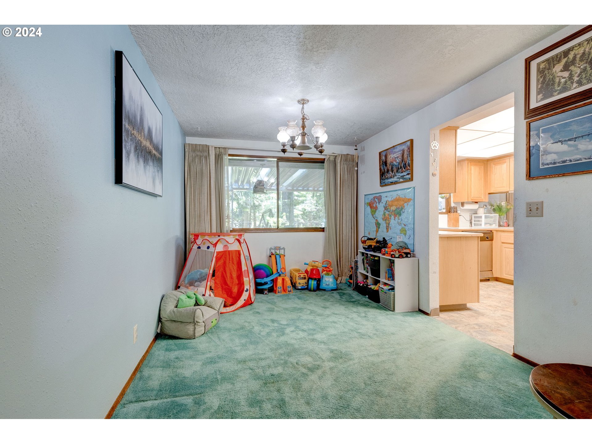 24100 Southwest Rosa Road Hillsboro, OR 97123 - Photo 7 of 30 a view of an empty room with furniture and windows