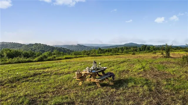 a view of a lake with houses in the back