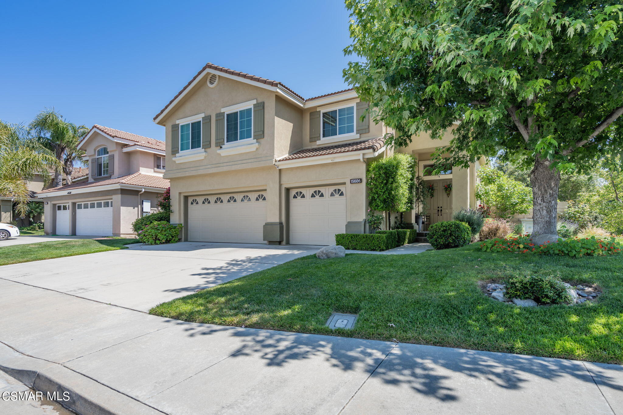 15606 Harte Lane Moorpark, CA 93021 - Photo 2 of 75 a front view of a house with a garden and plants