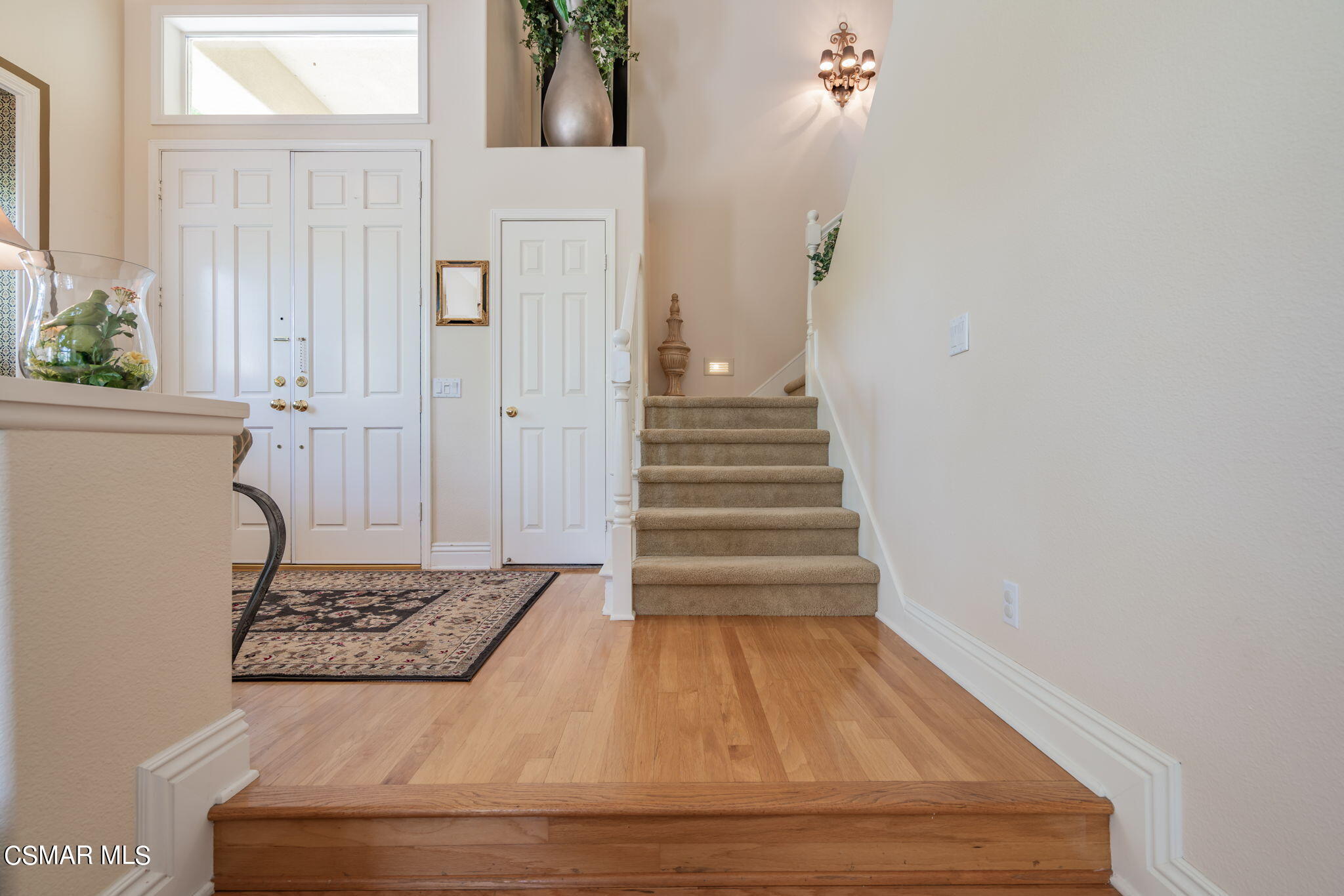 15606 Harte Lane Moorpark, CA 93021 - Photo 23 of 75 a view of a hallway with wooden floor and staircase