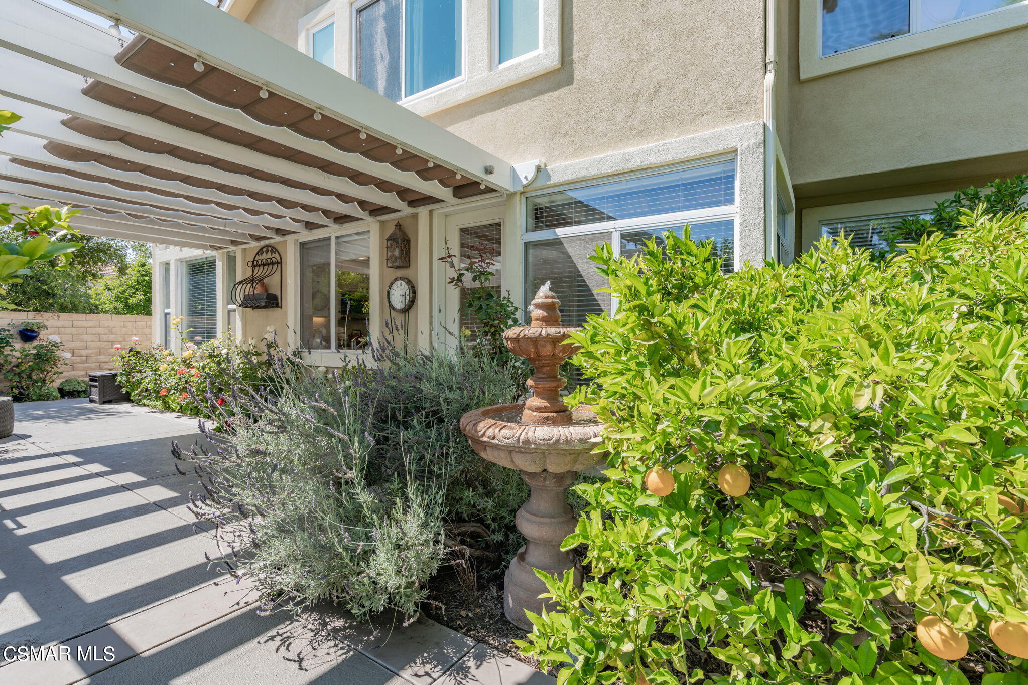 15606 Harte Lane Moorpark, CA 93021 - Photo 43 of 75 a view of a chair and table in the patio with potted plants