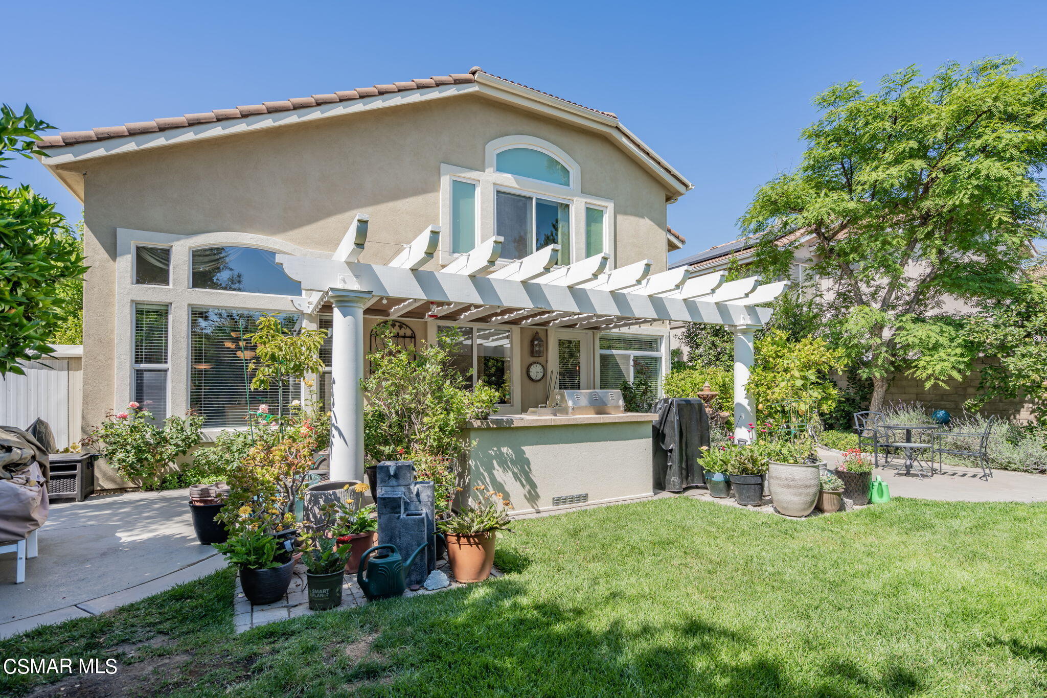 15606 Harte Lane Moorpark, CA 93021 - Photo 48 of 75 a front view of a house with a garden