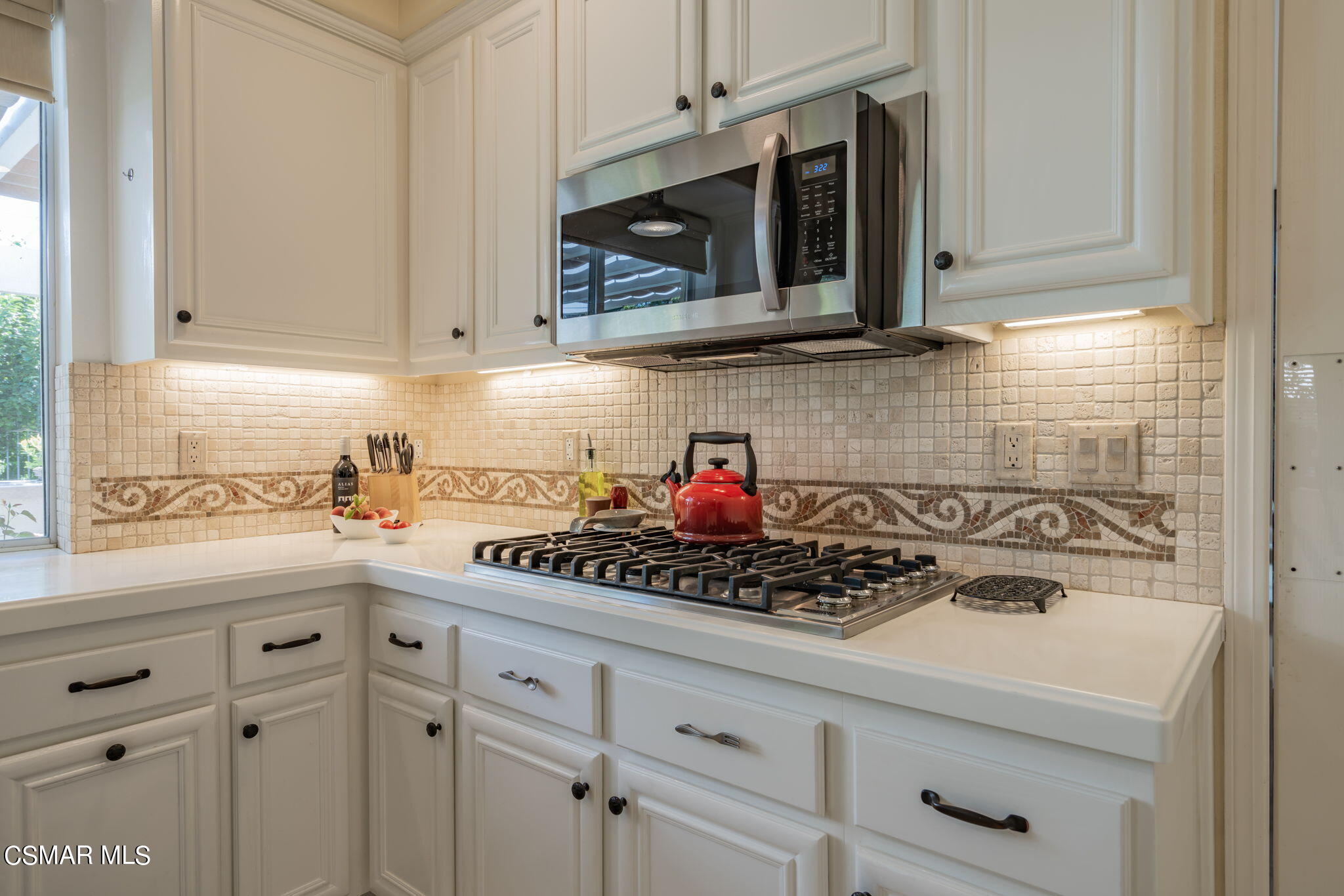 15606 Harte Lane Moorpark, CA 93021 - Photo 10 of 75 a kitchen with stainless steel appliances granite countertop white cabinets and a stove