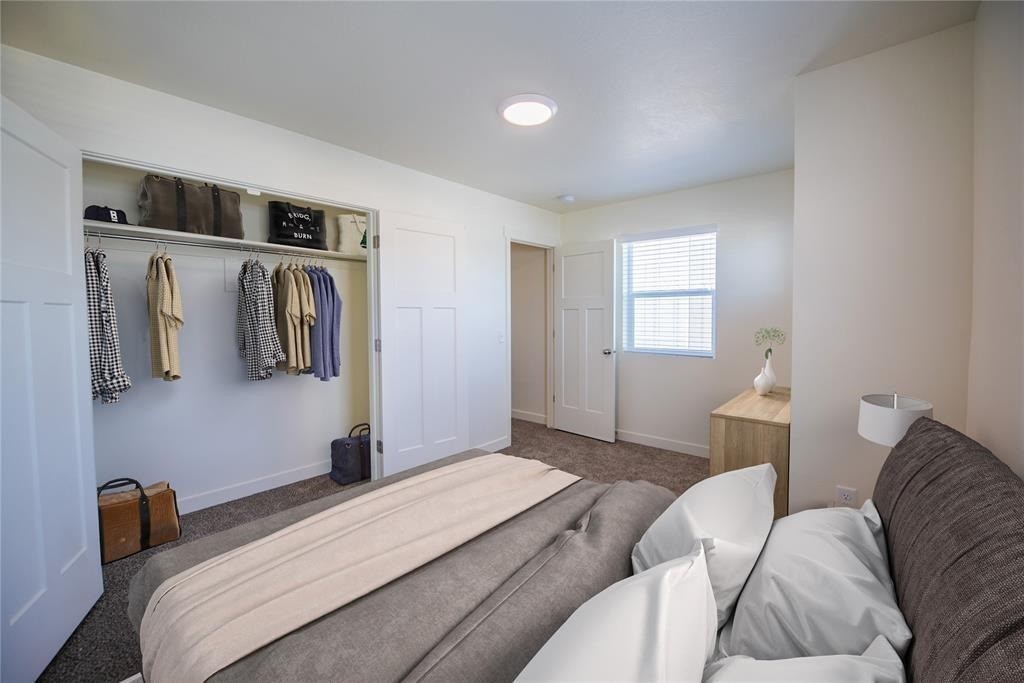 12603 Telge Road, Unit 7D Cypress, TX 77429 - Photo 8 of 19 a bedroom with a bed and walk in closet