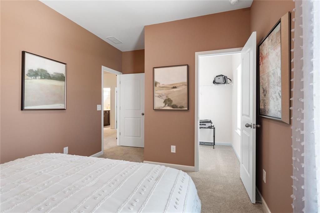 727 Sinclair Lane Temple, GA 30179 - Photo 31 of 44 a bedroom with a bed and a view of bathroom