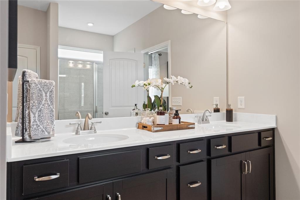 727 Sinclair Lane Temple, GA 30179 - Photo 42 of 44 a bathroom with a sink double vanity and a mirror