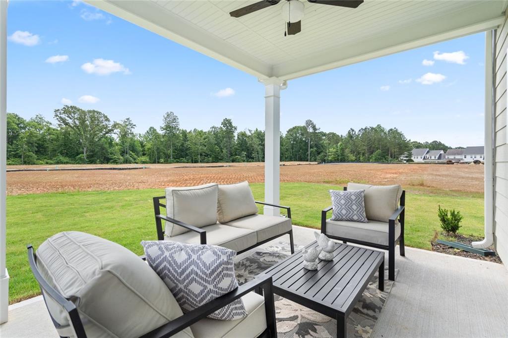 727 Sinclair Lane Temple, GA 30179 - Photo 44 of 44 a outdoor living space with furniture and garden view