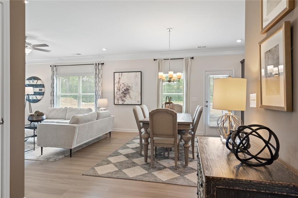 727 Sinclair Lane Temple, GA 30179 - Photo 6 of 44 a living room with furniture a window and gym equipment