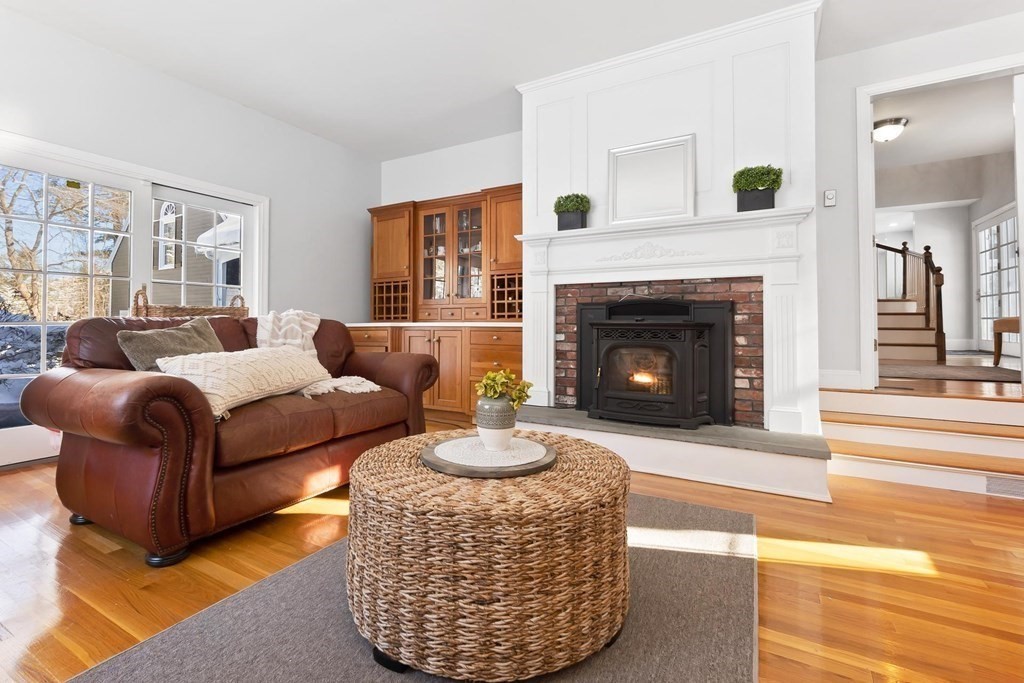64 Jenkins Road Andover, MA 01810 - Photo 13 of 31 a living room with furniture a fireplace and a large window