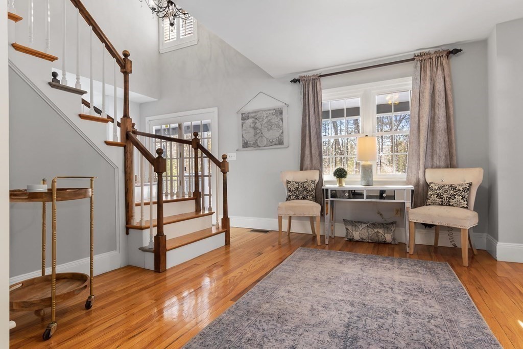 64 Jenkins Road Andover, MA 01810 - Photo 14 of 31 a living room with wooden floor and a table