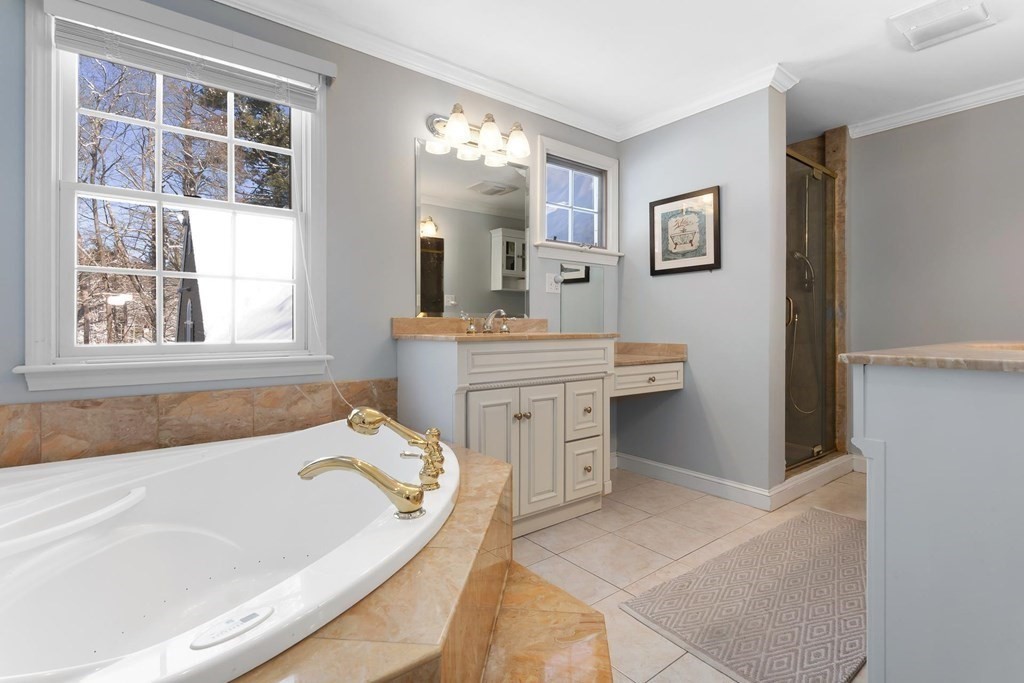 64 Jenkins Road Andover, MA 01810 - Photo 17 of 31 a bathroom with a tub sink and mirror