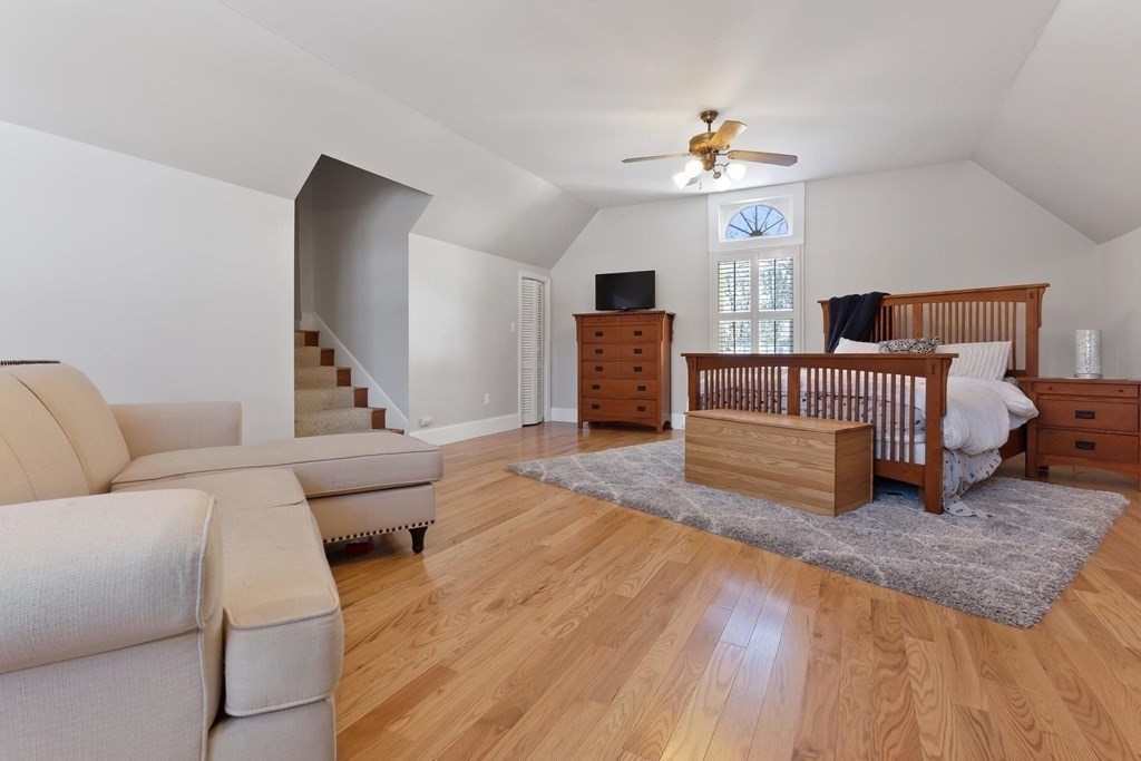 64 Jenkins Road Andover, MA 01810 - Photo 21 of 31 a living room with furniture and a chandelier