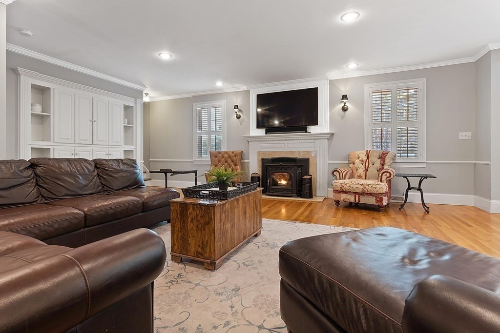 64 Jenkins Road Andover, MA 01810 - Photo 4 of 31 a living room with furniture or fireplace and a flat screen tv