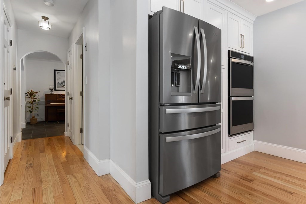 64 Jenkins Road Andover, MA 01810 - Photo 8 of 31 a kitchen with a refrigerator and a stove top oven