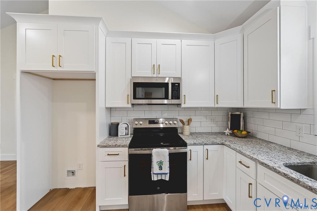 Tbd Summer Drive Ruther Glen, VA 22546 - Photo 12 of 25 a kitchen with granite countertop white cabinets and stainless steel appliances
