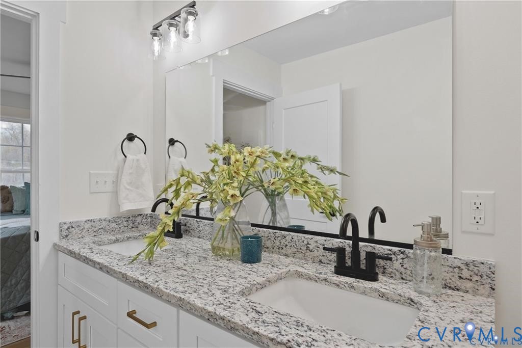 Tbd Summer Drive Ruther Glen, VA 22546 - Photo 16 of 25 a bathroom with a granite countertop sink and a mirror