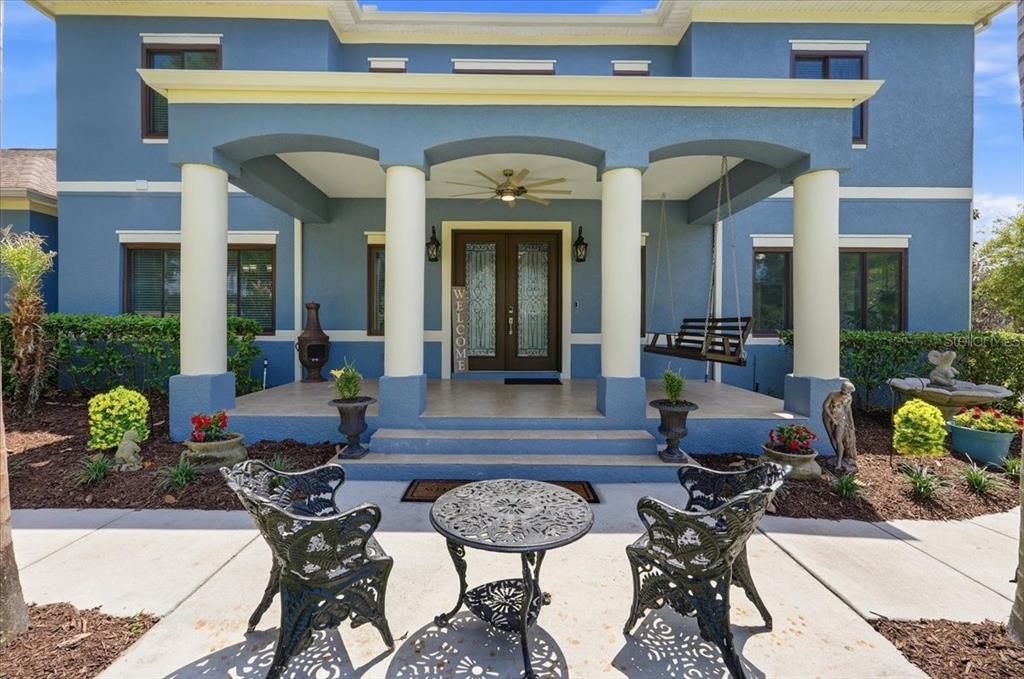 3943 West Campbell Road Lakeland, FL 33810 - Photo 12 of 95 a view of a patio with couches table and chairs and potted plants