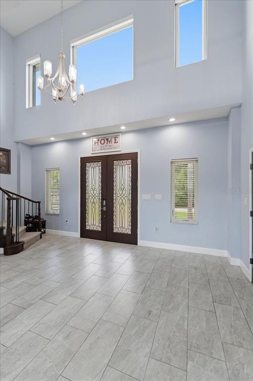3943 West Campbell Road Lakeland, FL 33810 - Photo 16 of 95 a view of an empty room with a chandelier