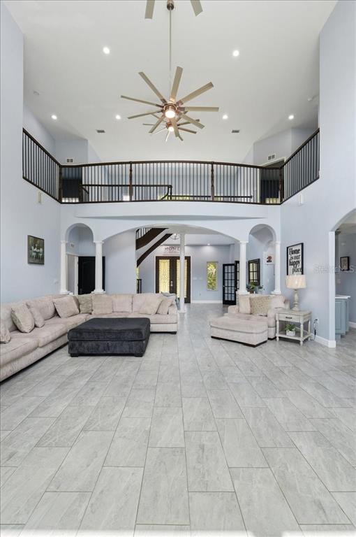 3943 West Campbell Road Lakeland, FL 33810 - Photo 25 of 95 a living room with furniture and a chandelier