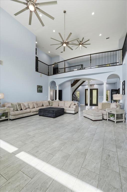 3943 West Campbell Road Lakeland, FL 33810 - Photo 29 of 95 a living room with furniture and a chandelier