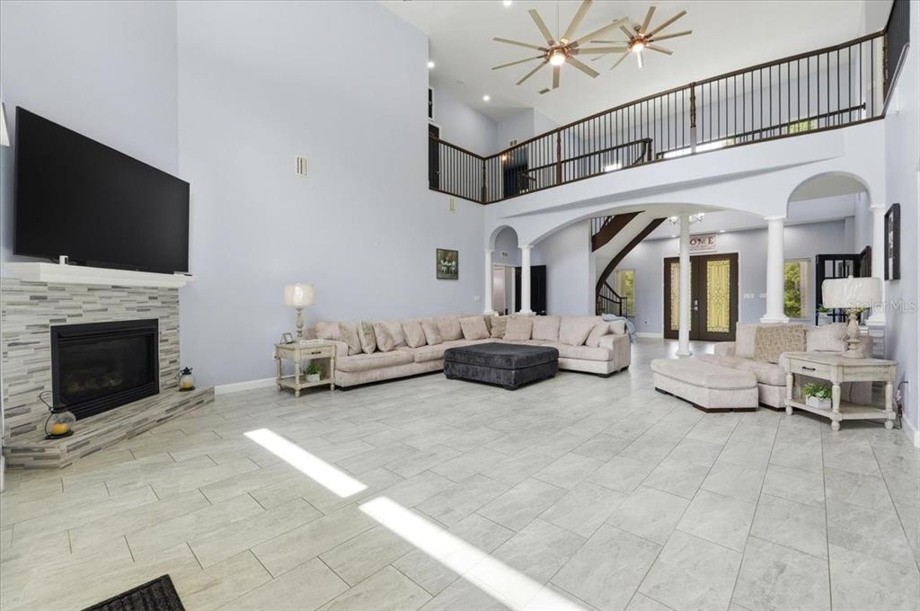 3943 West Campbell Road Lakeland, FL 33810 - Photo 30 of 95 a living room with furniture and a flat screen tv