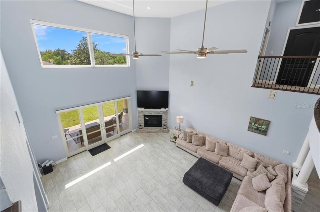 3943 West Campbell Road Lakeland, FL 33810 - Photo 31 of 95 a view of a livingroom with furniture and a flat screen tv