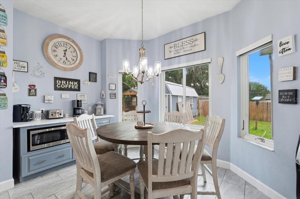 3943 West Campbell Road Lakeland, FL 33810 - Photo 39 of 95 a view of a dining room with furniture window and wooden floor