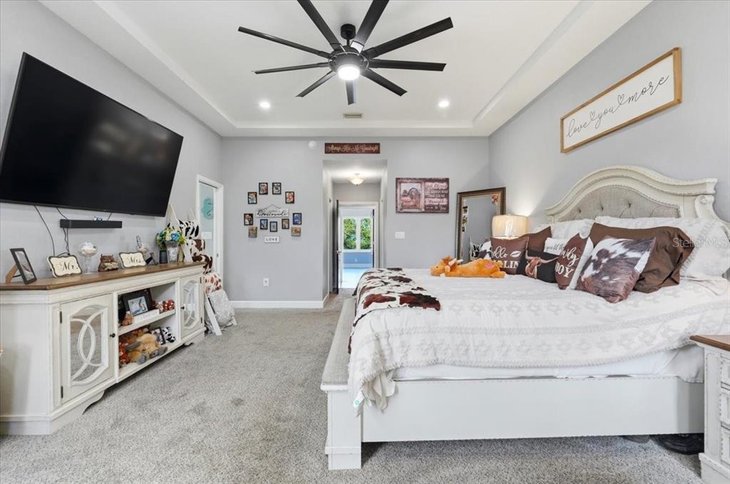 3943 West Campbell Road Lakeland, FL 33810 - Photo 44 of 95 a bedroom with a bed and a flat screen tv