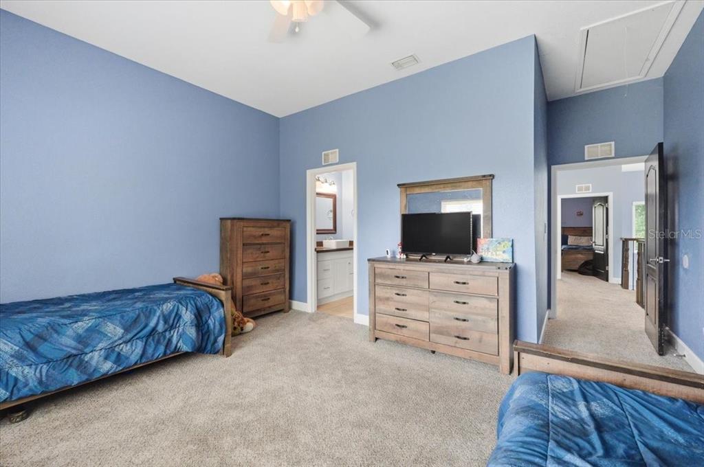 3943 West Campbell Road Lakeland, FL 33810 - Photo 69 of 95 a living room with furniture and a flat screen tv