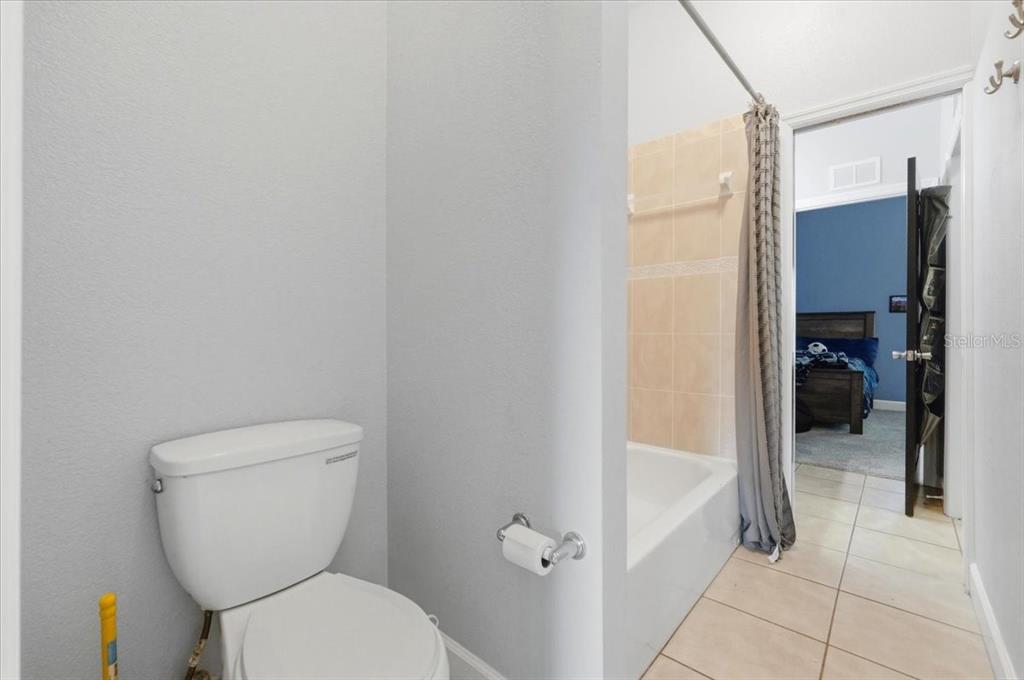 3943 West Campbell Road Lakeland, FL 33810 - Photo 72 of 95 a bathroom with a toilet and a shower