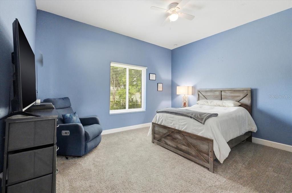 3943 West Campbell Road Lakeland, FL 33810 - Photo 80 of 95 a bed room with a bed and a television