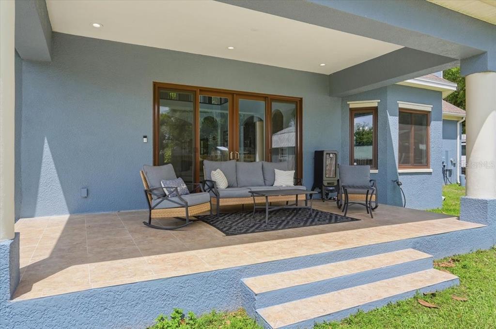 3943 West Campbell Road Lakeland, FL 33810 - Photo 85 of 95 a living room with patio furniture and floor to ceiling window