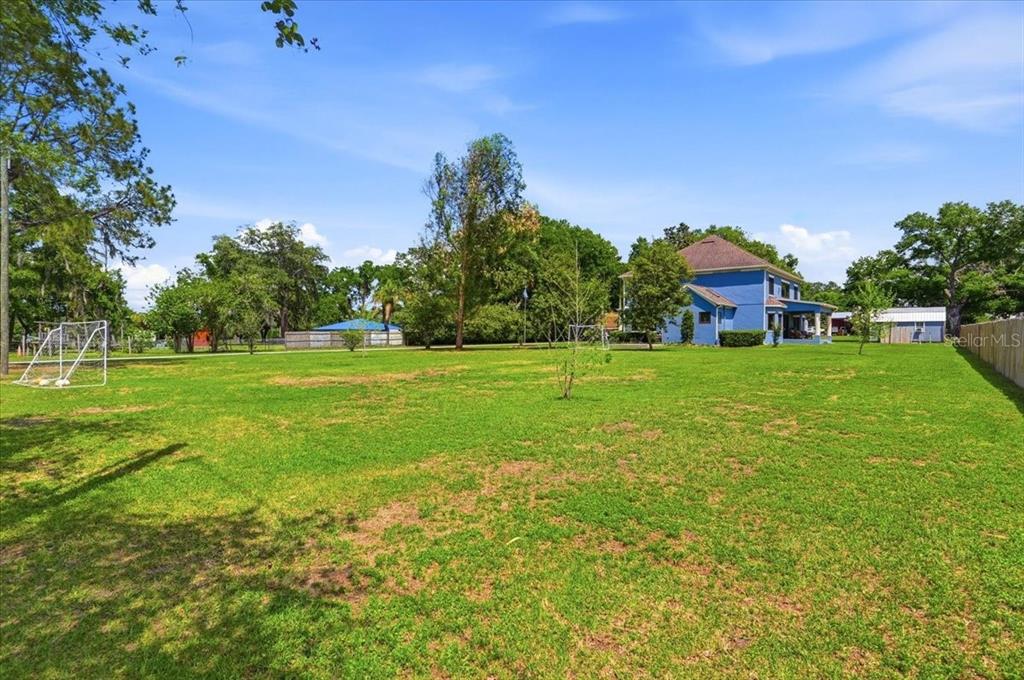 3943 West Campbell Road Lakeland, FL 33810 - Photo 90 of 95 a view of a house with a big yard