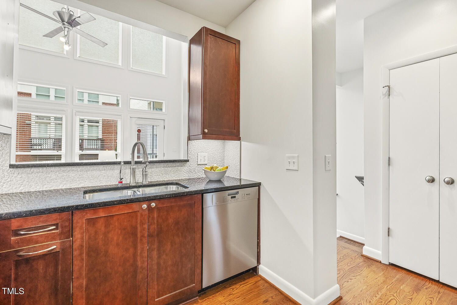 805 The Village Circle Raleigh, NC 27615 - Photo 15 of 42 a bathroom with a granite countertop sink and a mirror