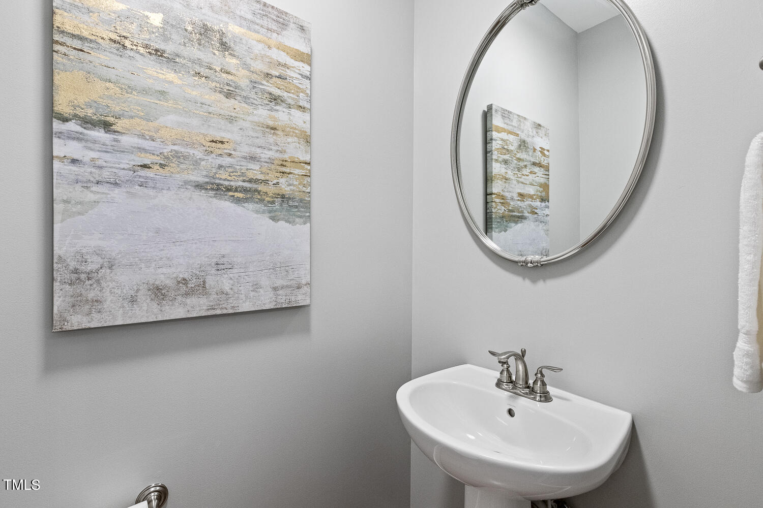 805 The Village Circle Raleigh, NC 27615 - Photo 17 of 42 a bathroom with a sink and a mirror
