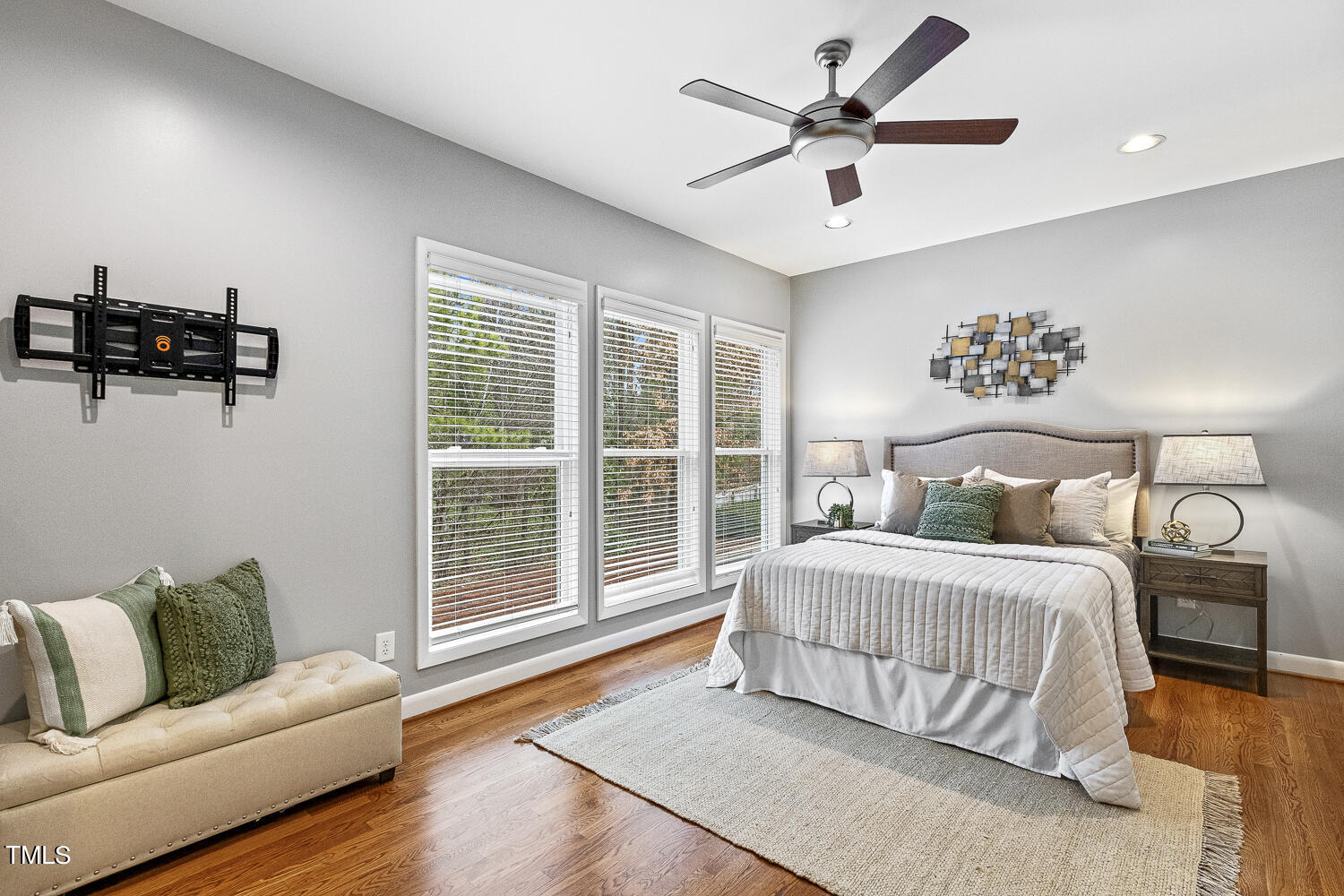 805 The Village Circle Raleigh, NC 27615 - Photo 18 of 42 a bedroom with a large bed and a couch